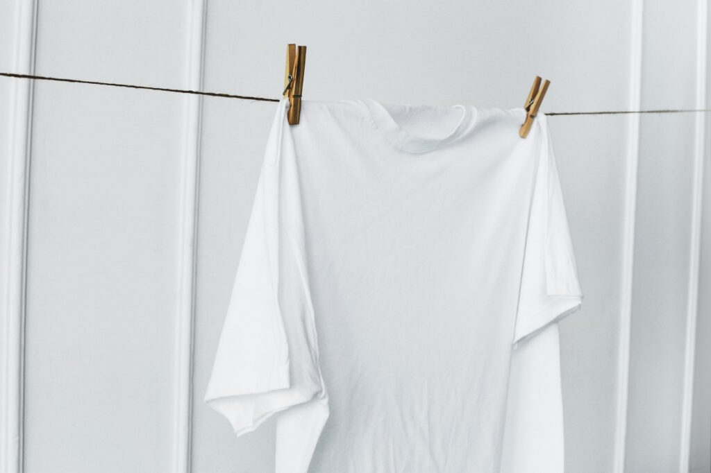 White shirt hanging by the wall